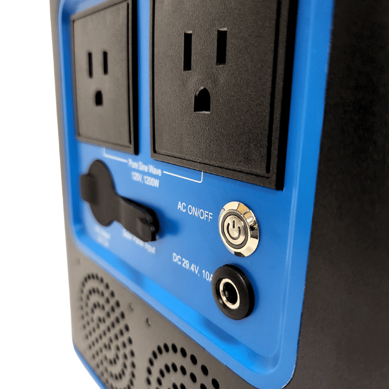 Close-up of two electrical outlets, a power button, and a DC input on the Hey Bata Minor League Pitching Machine Training Package—perfect for powering equipment at youth baseball practices or Little League games.